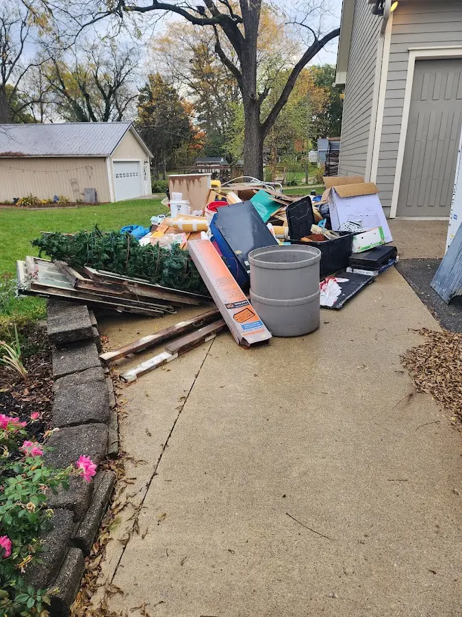 Dumpster being loaded with debris for 3 Yard Dumpster Rental in Alexandria
